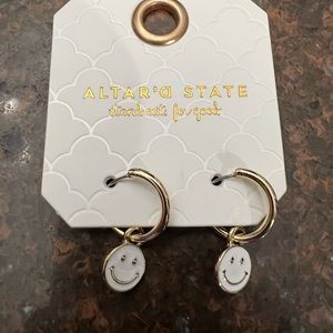 Brand new Altar’D State white smiley face earrings. One size fits all